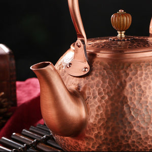 Close-up of the hammered copper spout and lid knob on the Auren teapot