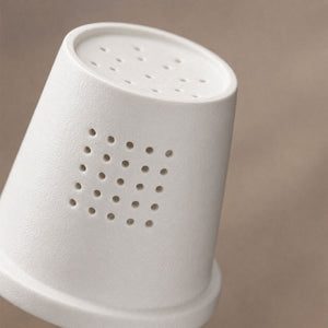 Close-up of the perforated ceramic infuser of the Hakone Mountain White mug
