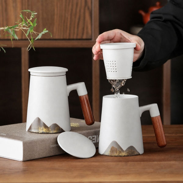 Tea steeping in the removable ceramic infuser of the Hakone Mountain White mug
