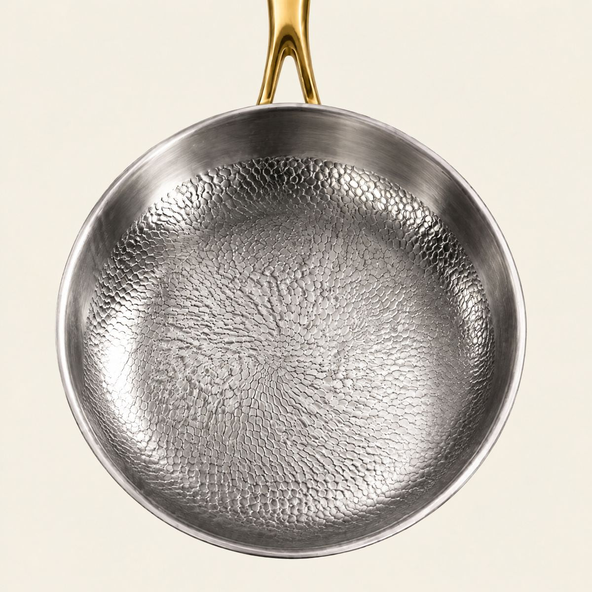 Top view of the hammered titanium frying pan with gold handle