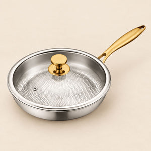 Hammered titanium frying pan with gold handle and glass lid with gold knob