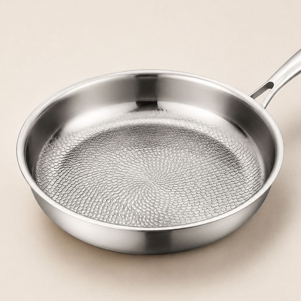 Angled view of the hammered titanium frying pan showing its textured base