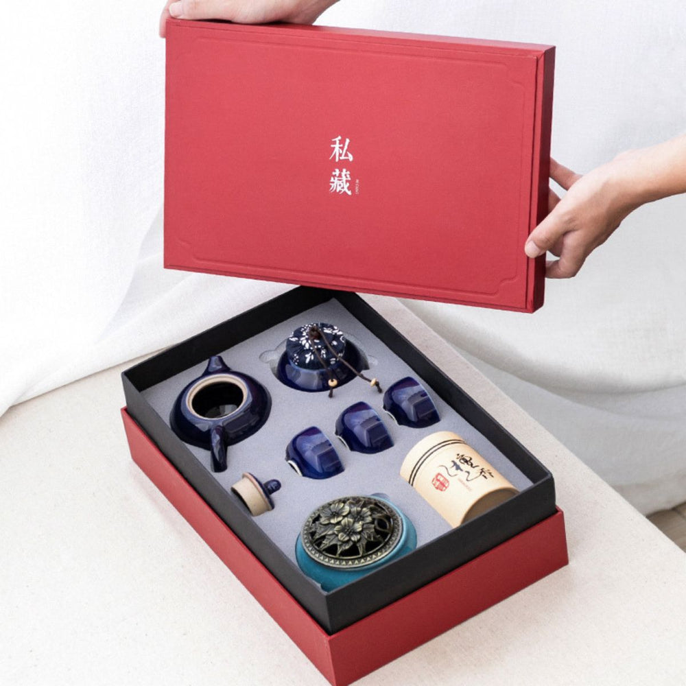 Red gift box opened on the Jing midnight blue porcelain tea set