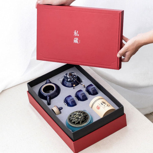 Red gift box opened on the Jing midnight blue porcelain tea set