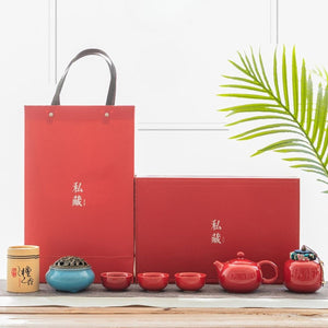 Jing red tea set shown with its red gift box and matching carrier bag