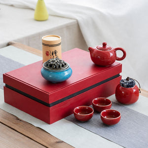 Jing red tea set displayed on top of its closed gift box