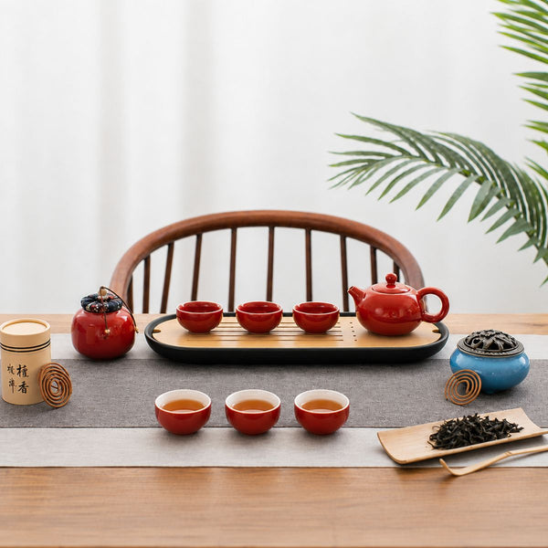 Jing red tea set laid out on a tea tray with loose leaf tea