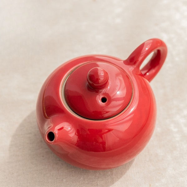 Close-up of the Jing red porcelain teapot and its fitted lid