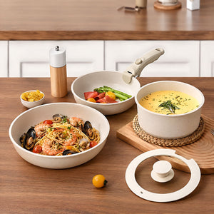 Kasane frying pans and saucepan served at the table with pasta and soup