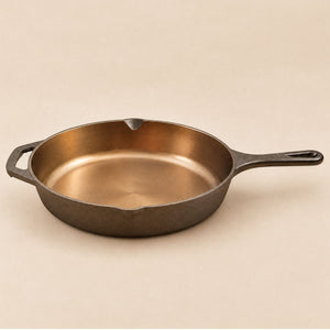Side view of the Kazan cast iron skillet pan with pour spouts and helper handle