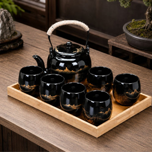 Kumo black Japanese ceramic tea set with teapot and six cups on a bamboo tray