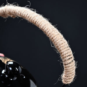 Close-up of the wrapped rope handle on the Kumo black ceramic teapot