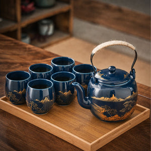 Kumo deep blue Japanese ceramic tea set with teapot and six cups on a bamboo tray