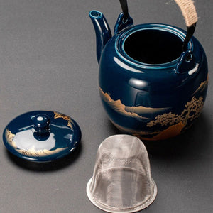 Kumo deep blue ceramic teapot with its lid and stainless steel strainer removed