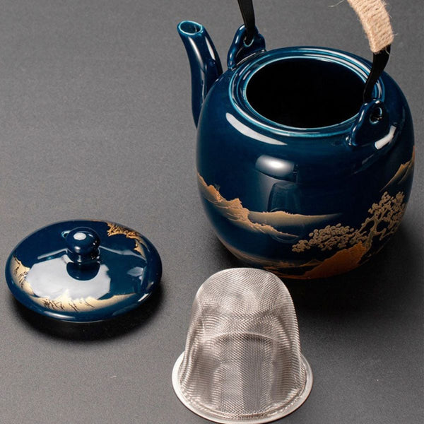 Kumo deep blue ceramic teapot with its lid and stainless steel strainer removed
