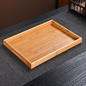 Bamboo serving tray with cut-out handles included with the Kumo tea set