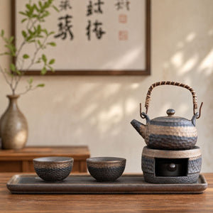 Renji Japanese wabi-sabi pottery tea set with teapot on its candle warmer, two cups and serving tray