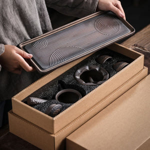 Renji serving tray lifted from the box with the tea set pieces packed inside