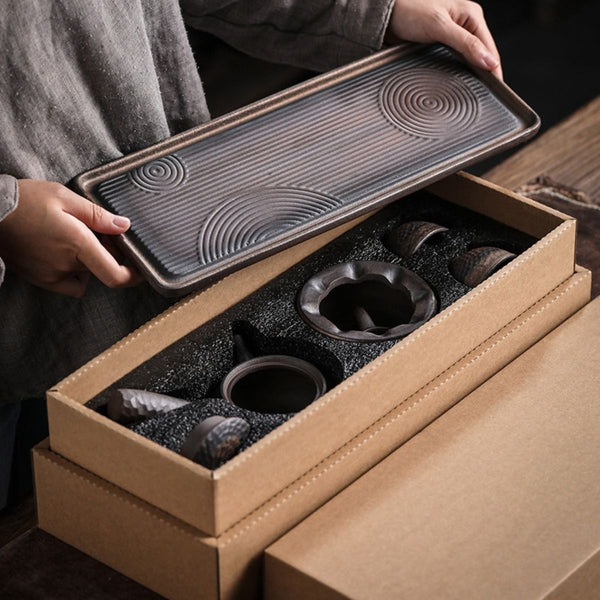 Renji serving tray lifted from the box with the tea set pieces packed inside
