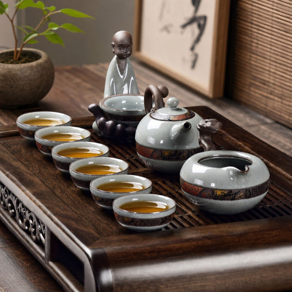 Yunlong Ruyao ceramic tea set on a wooden tea tray with six filled tea cups